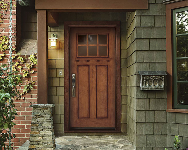 Wooden farmhouse-style front entry door