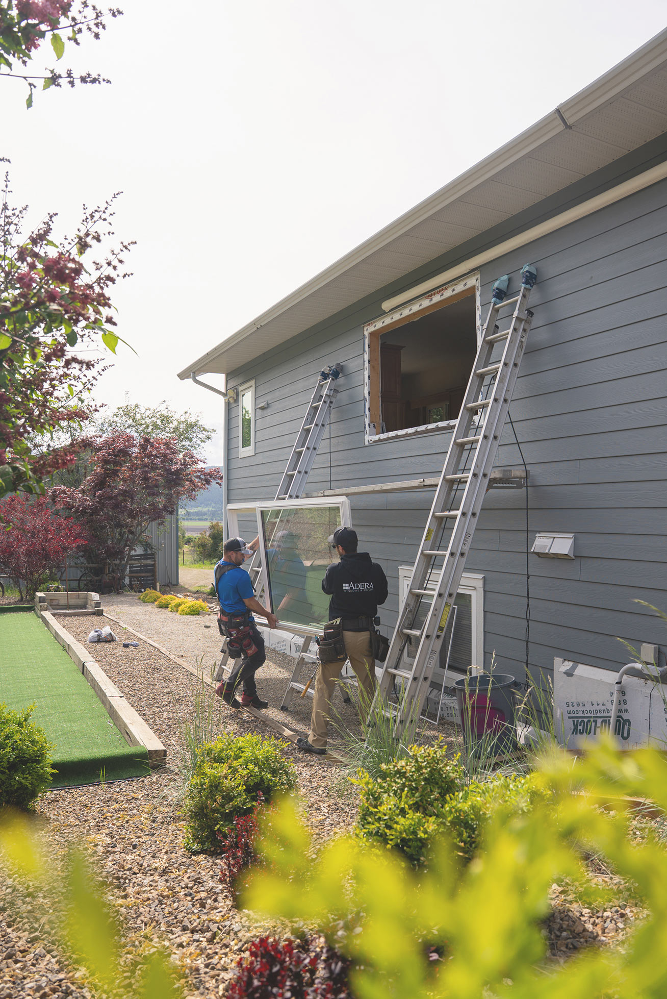 The Adera team installs a new window in a Kelowna home