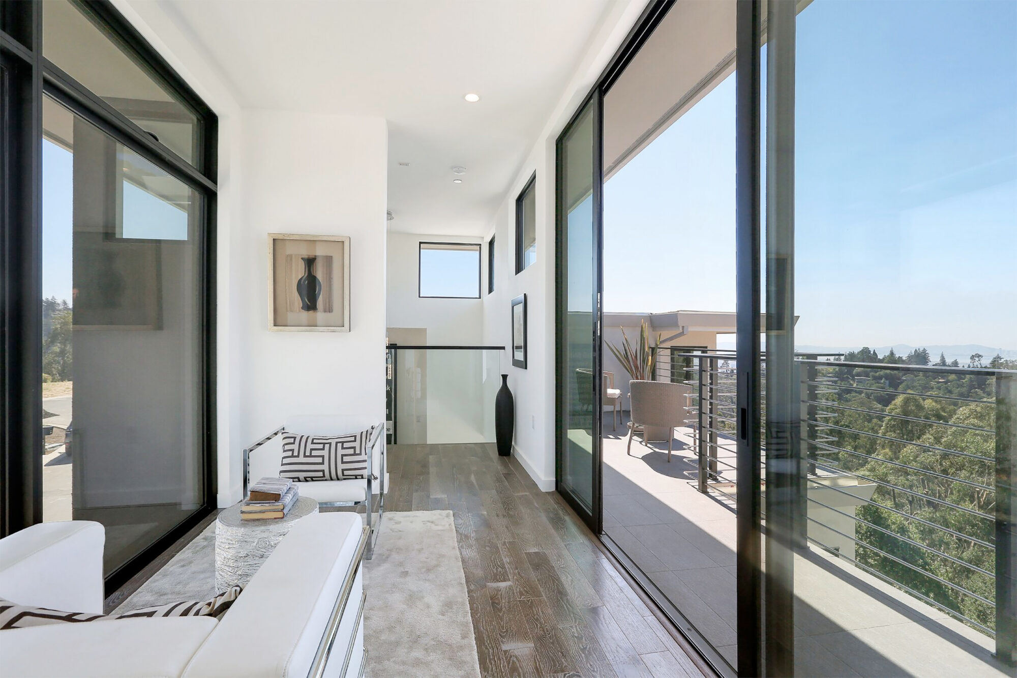 Large windows overlooking a forest in a beautiful, new house.