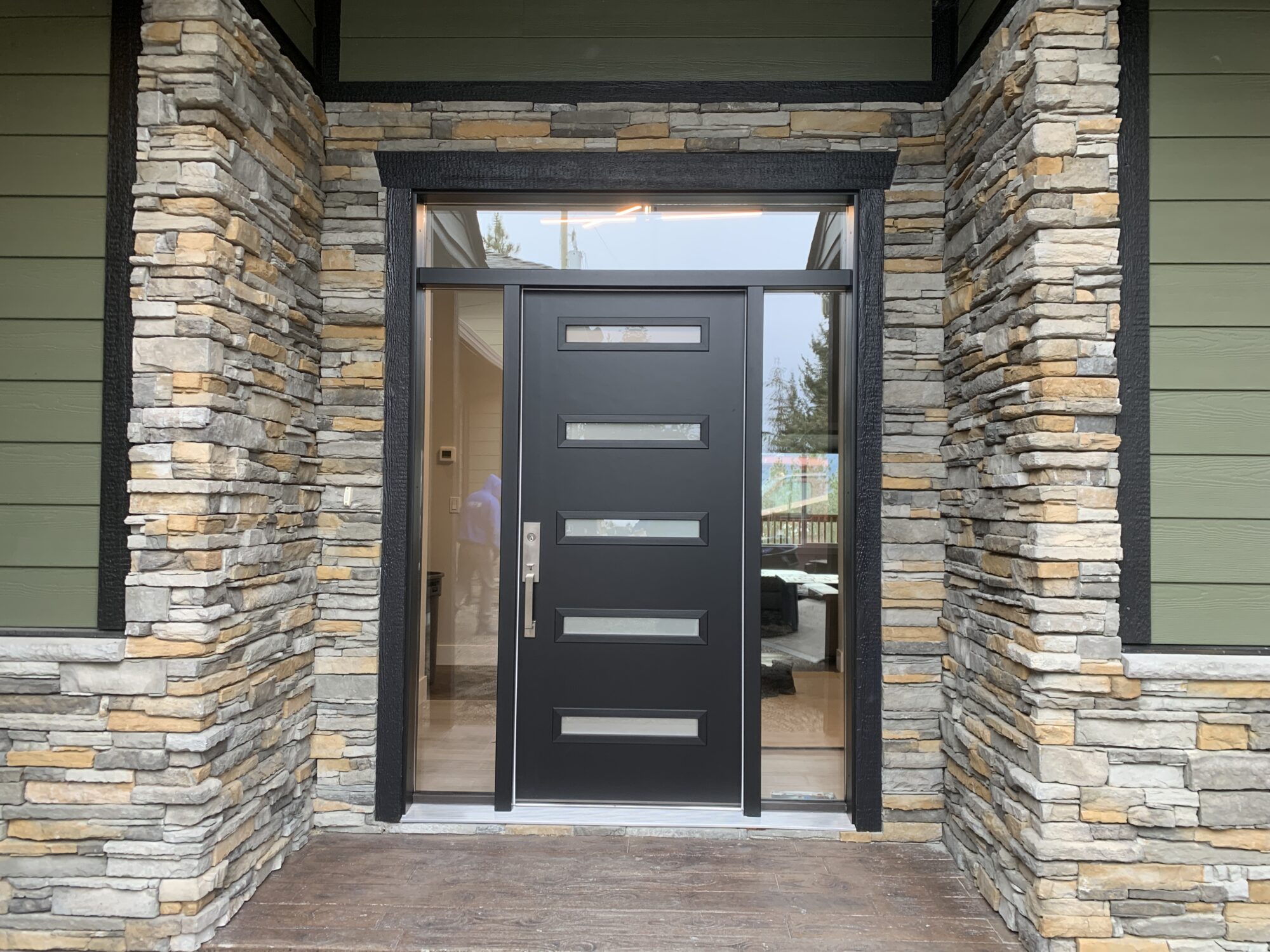 Modern entry way door at a residential home in Armtsrong, BC